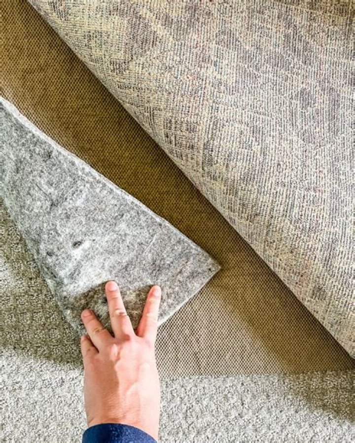 How do I keep a rug from moving on carpet