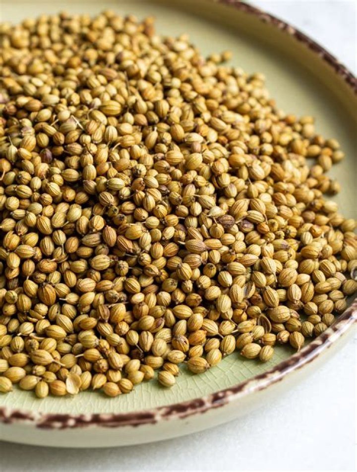 How many grams is one cup of coriander seeds?