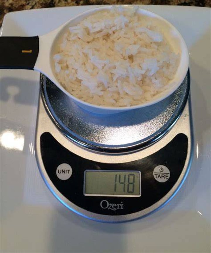 How much is 150 grams of rice in tablespoons?