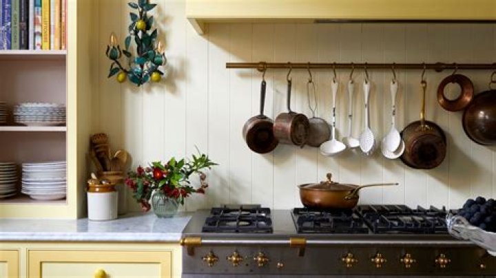 How should pots and pans be stored in a small kitchen