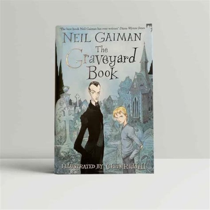 What does the lady in GREY symbolize in the graveyard book