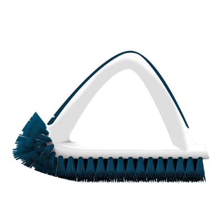 What is a grout brush used for
